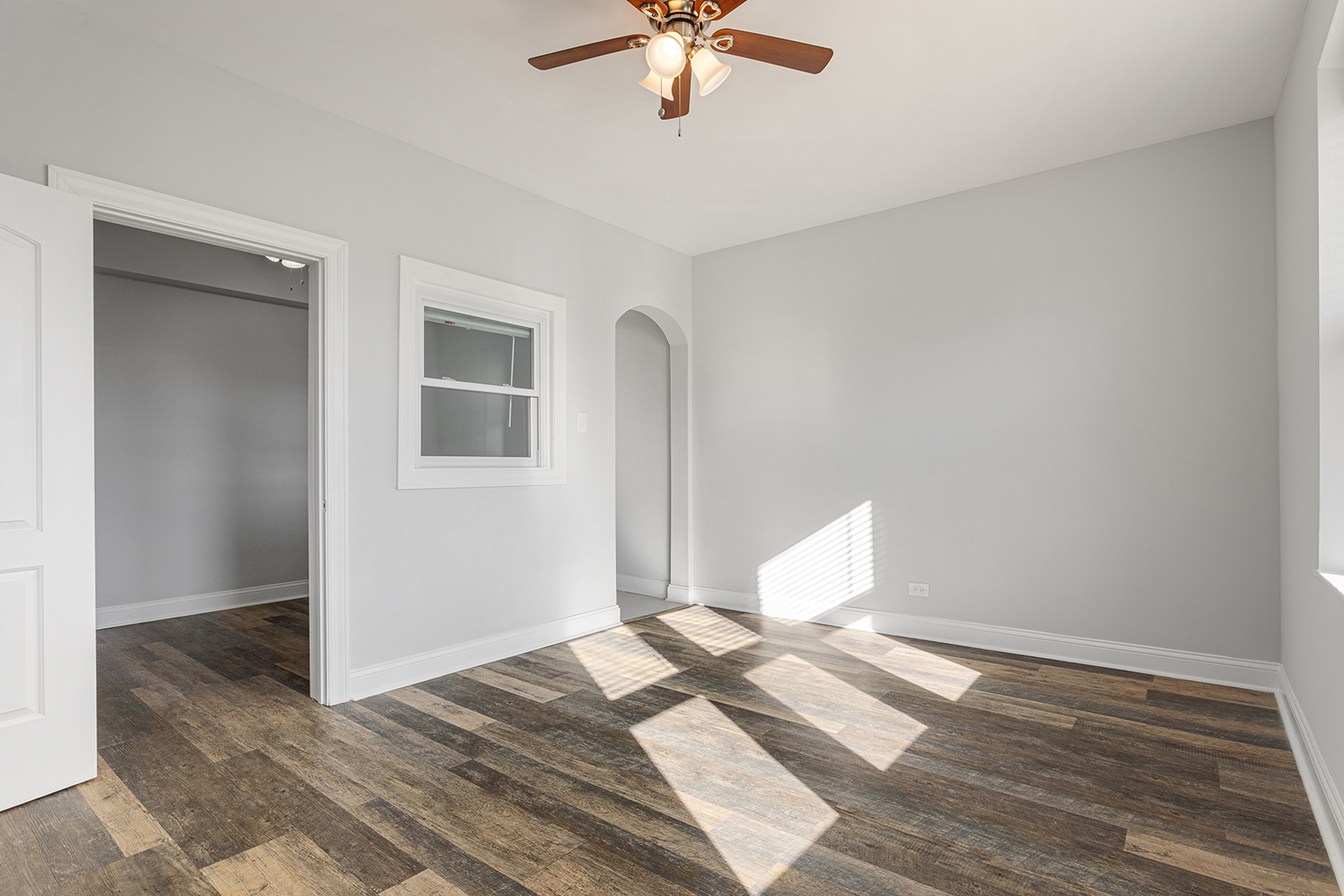 1608 West Sherwin Avenue, Unit 710 Chicago, IL 60626 - Photo 4 of 13 a view of a room with a ceiling fan and wooden floor