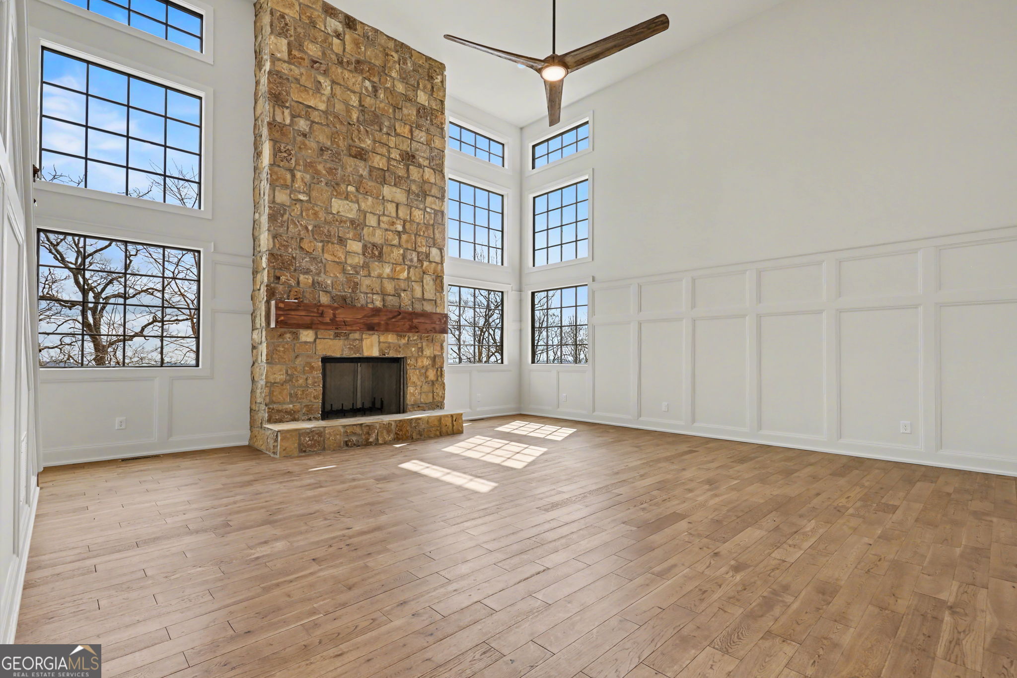 416 Winding View Clayton, GA 30525 - Photo 22 of 61 a view of an empty room with a fireplace and a window