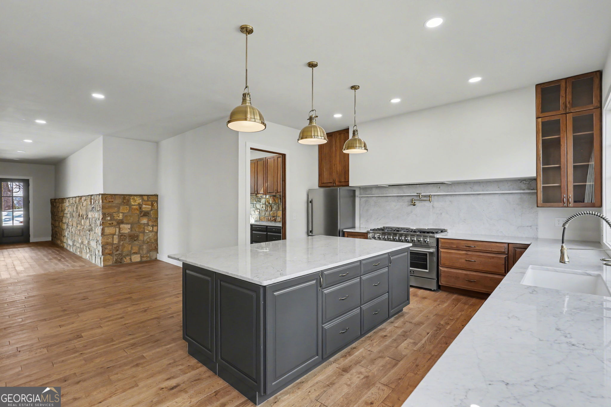 416 Winding View Clayton, GA 30525 - Photo 24 of 61 a large kitchen with stainless steel appliances granite countertop a sink a stove and a wooden floors