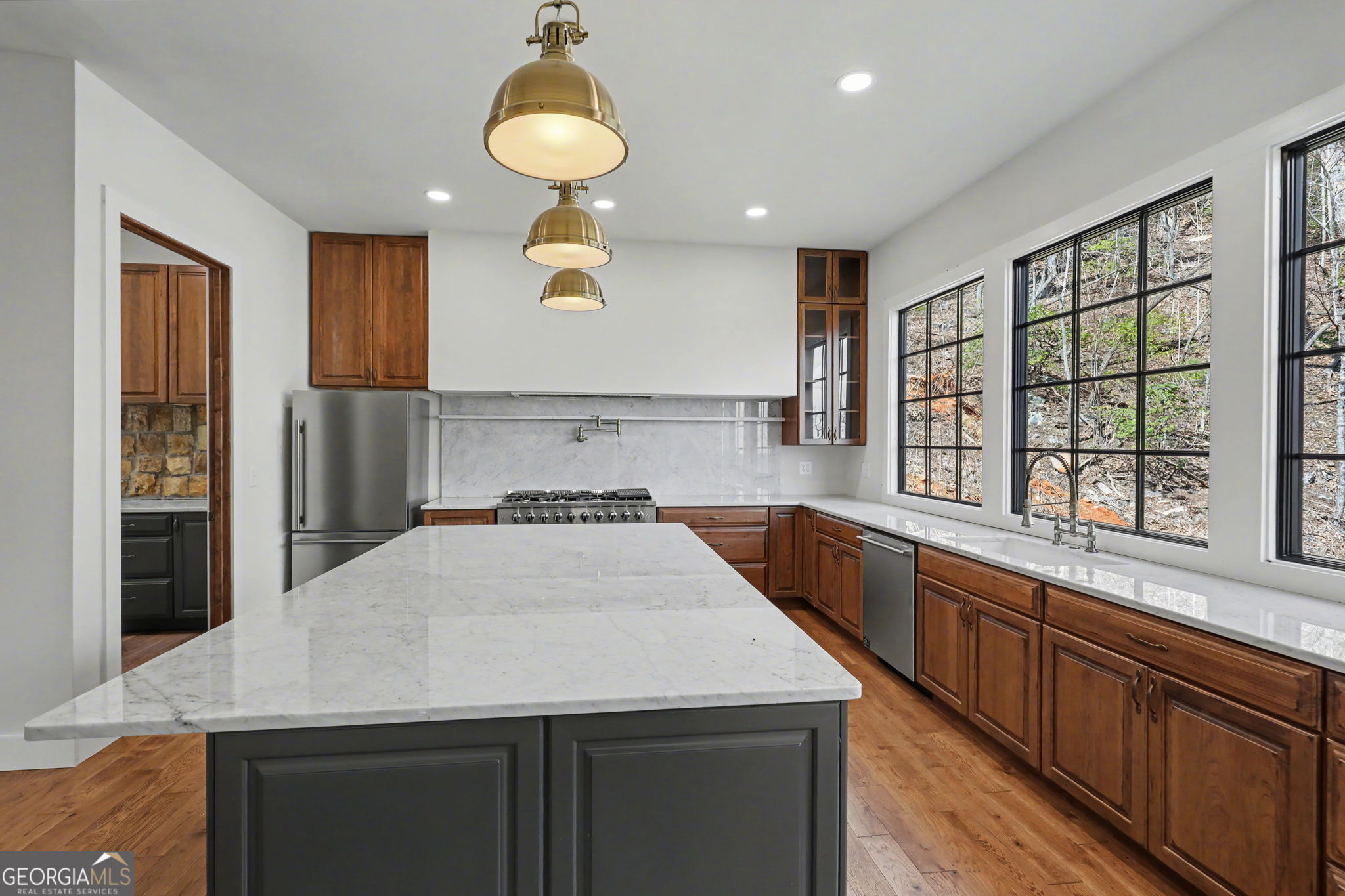 416 Winding View Clayton, GA 30525 - Photo 26 of 61 a kitchen with stainless steel appliances granite countertop a sink a stove and a refrigerator