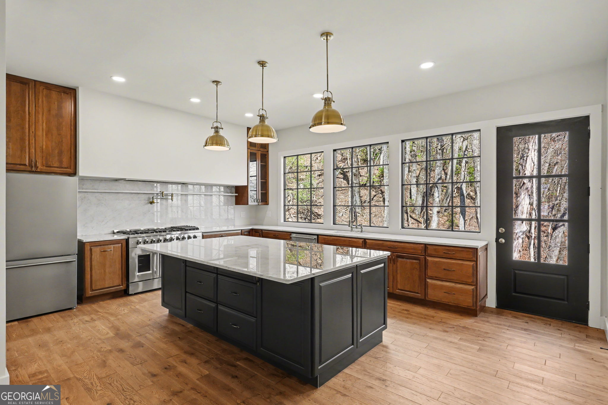 416 Winding View Clayton, GA 30525 - Photo 27 of 61 a kitchen with stainless steel appliances granite countertop a stove and a sink