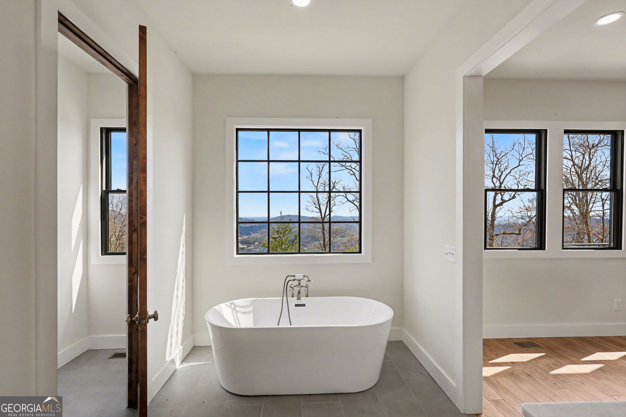 416 Winding View Clayton, GA 30525 - Photo 33 of 61 a spacious bathroom with a bathtub and next to a window