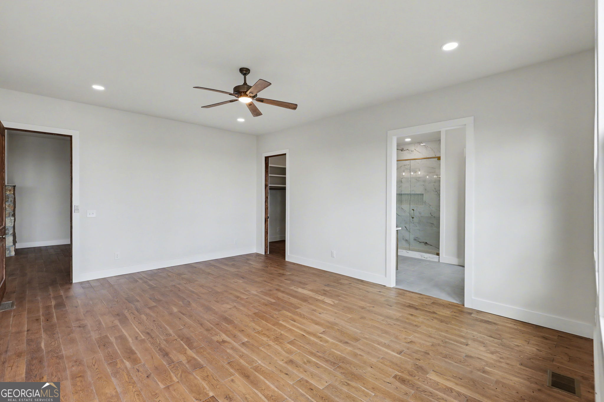 416 Winding View Clayton, GA 30525 - Photo 40 of 61 a view of empty room with wooden floor and fan