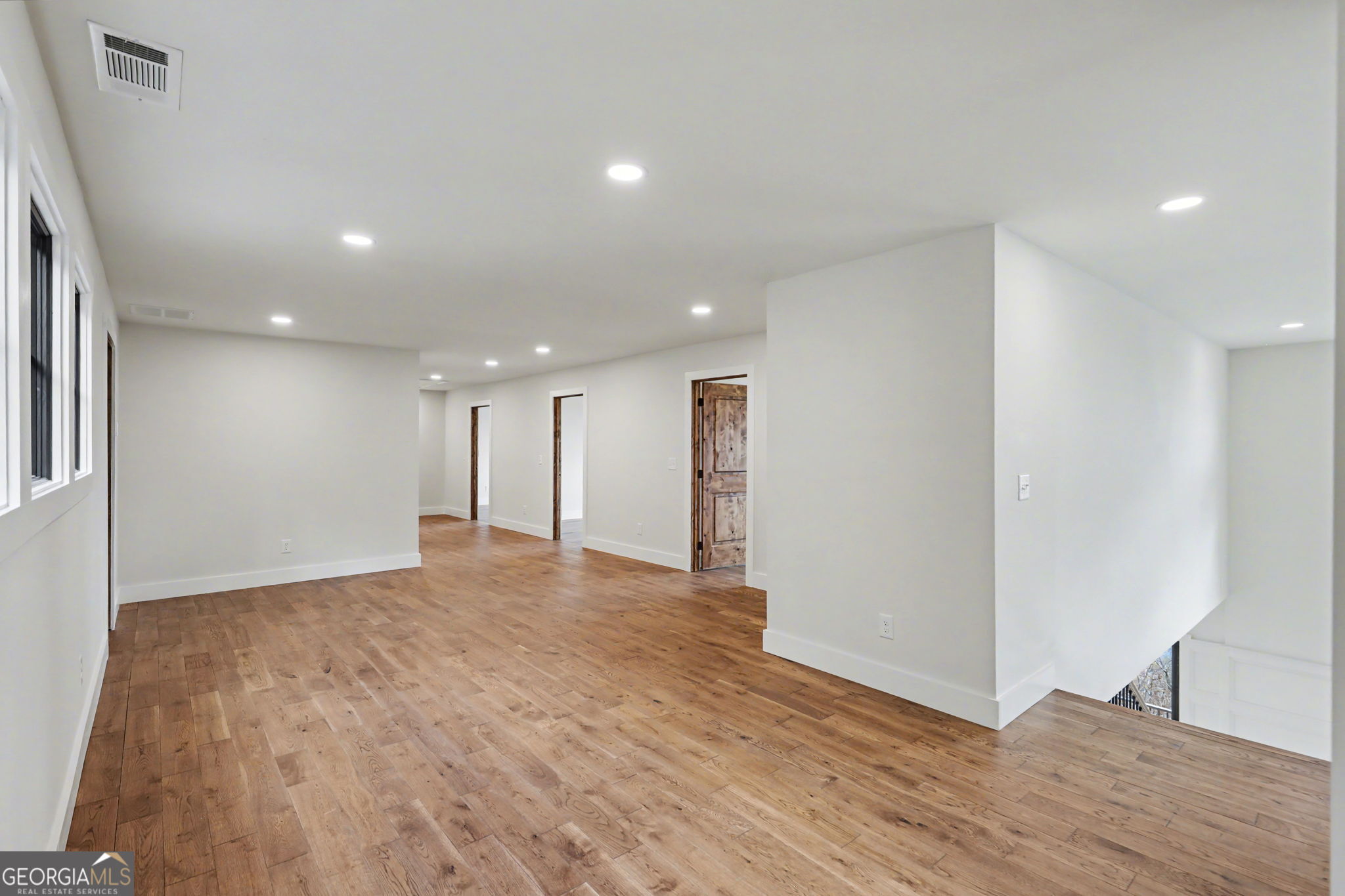 416 Winding View Clayton, GA 30525 - Photo 42 of 61 a view of an empty room with wooden floor