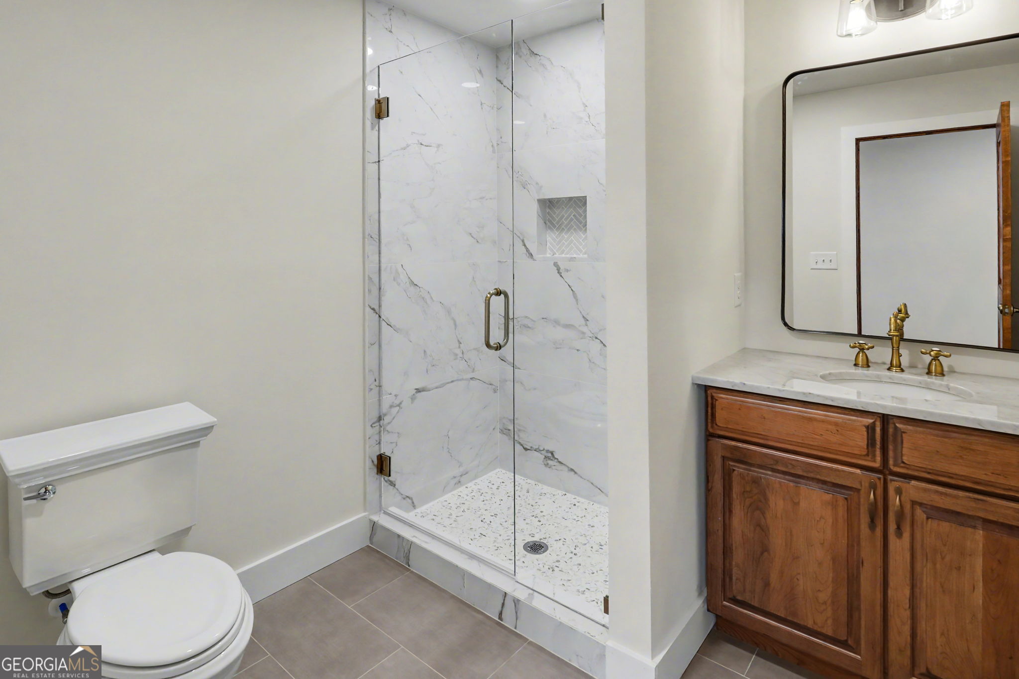 416 Winding View Clayton, GA 30525 - Photo 48 of 61 a bathroom with a granite countertop sink mirror vanity and toilet