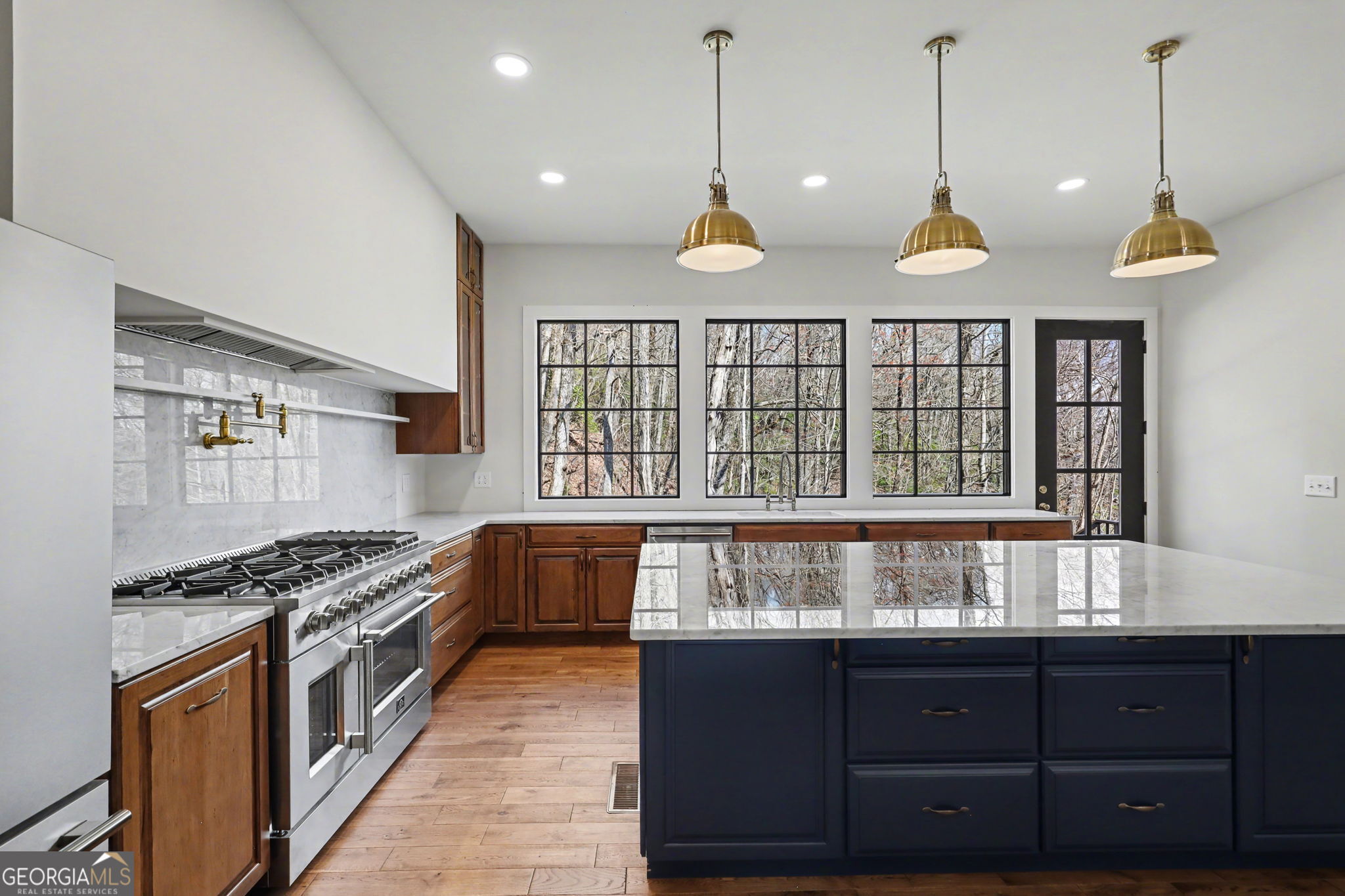 416 Winding View Clayton, GA 30525 - Photo 5 of 61 a kitchen with stainless steel appliances granite countertop a stove a sink and a wooden floors