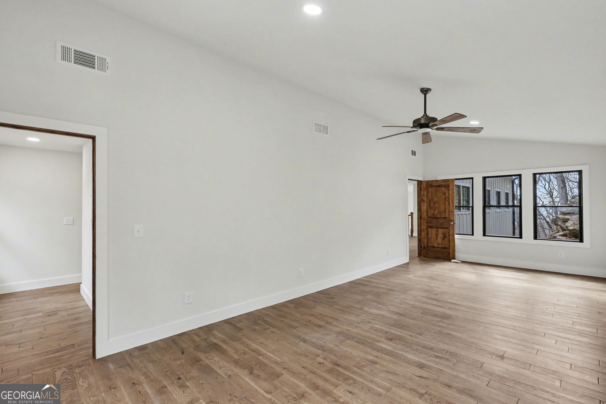 416 Winding View Clayton, GA 30525 - Photo 52 of 61 a view of empty room with wooden floor and fan