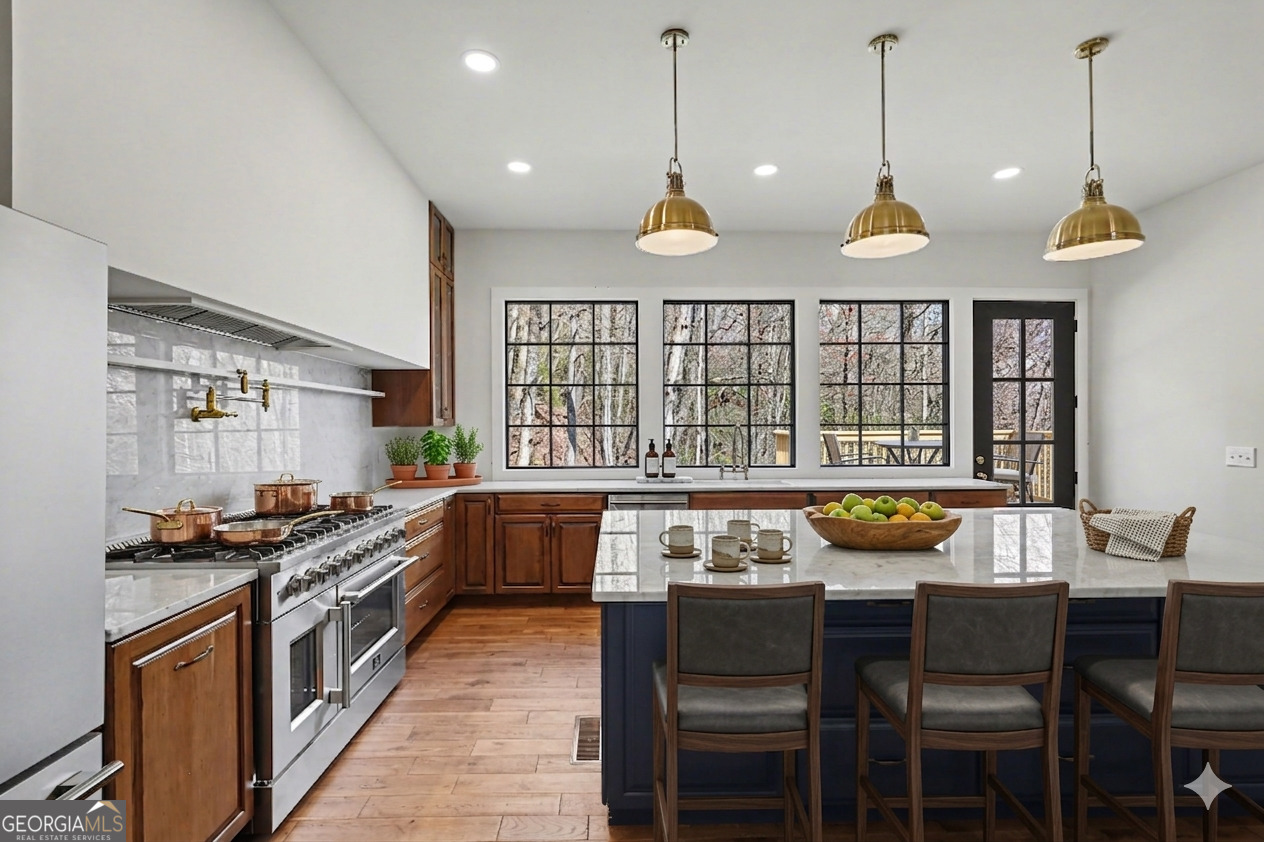 416 Winding View Clayton, GA 30525 - Photo 6 of 61 a view of a kitchen with stainless steel appliances granite countertop a stove a sink a dining table and chairs