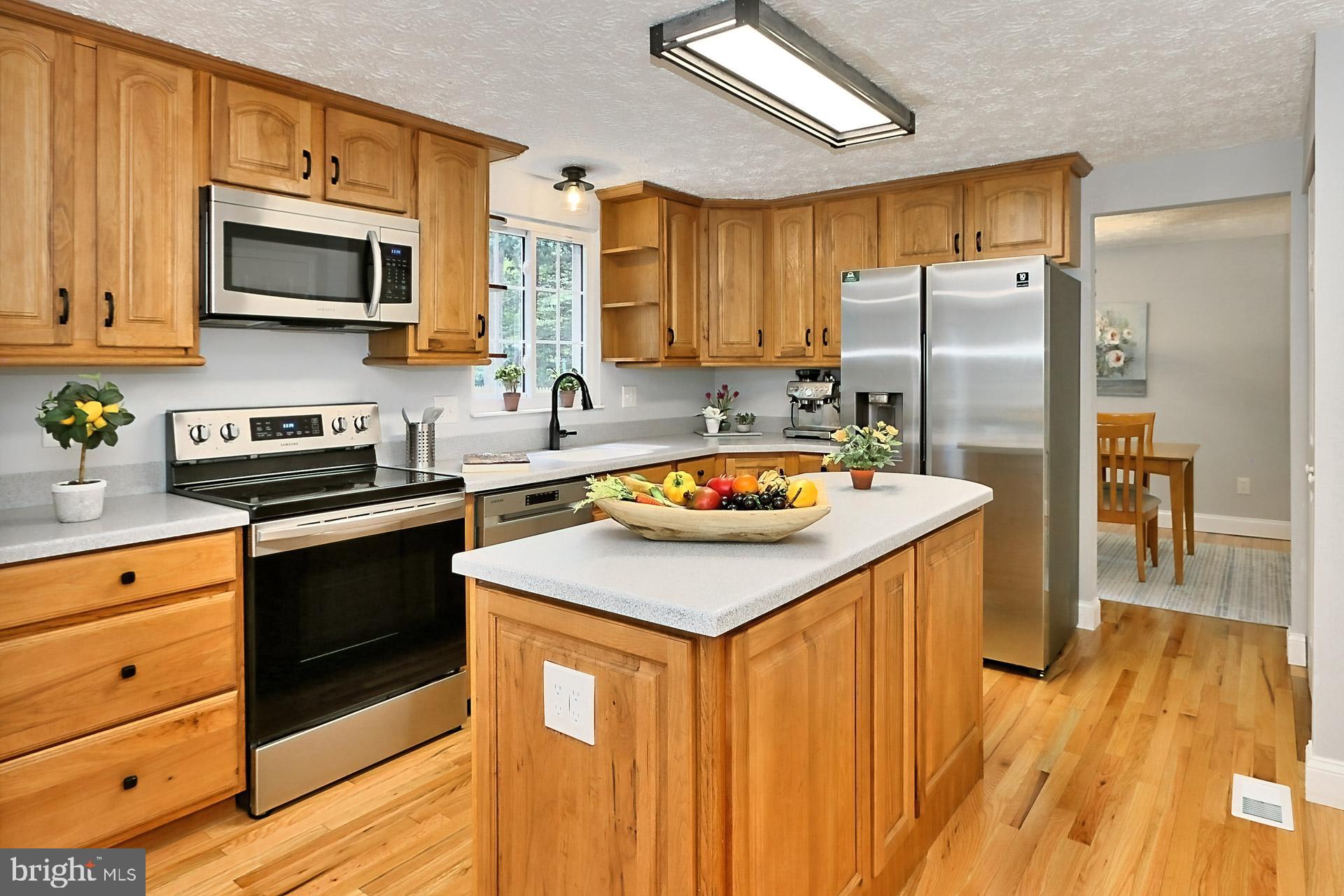 8285 Deep Valley Court Springfield, VA 22153 - Photo 12 of 39 Stainless appliances including flat top range