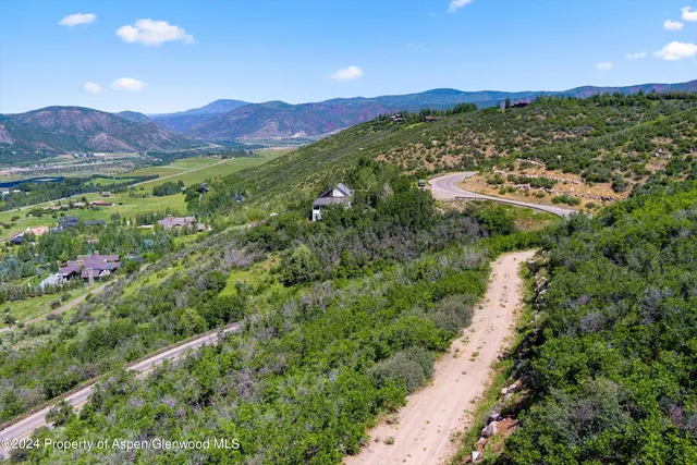 a view of a city with mountains in the background