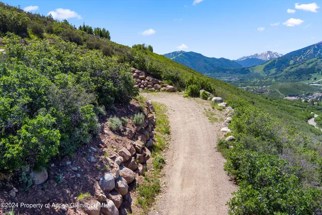 a view of a lake with mountains in the background