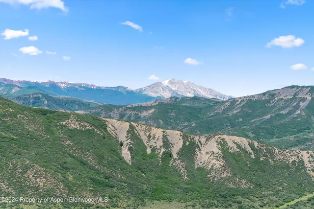 a view of mountain with lake view