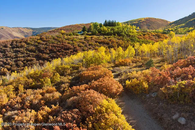a view of a large body of water with a mountain in the background