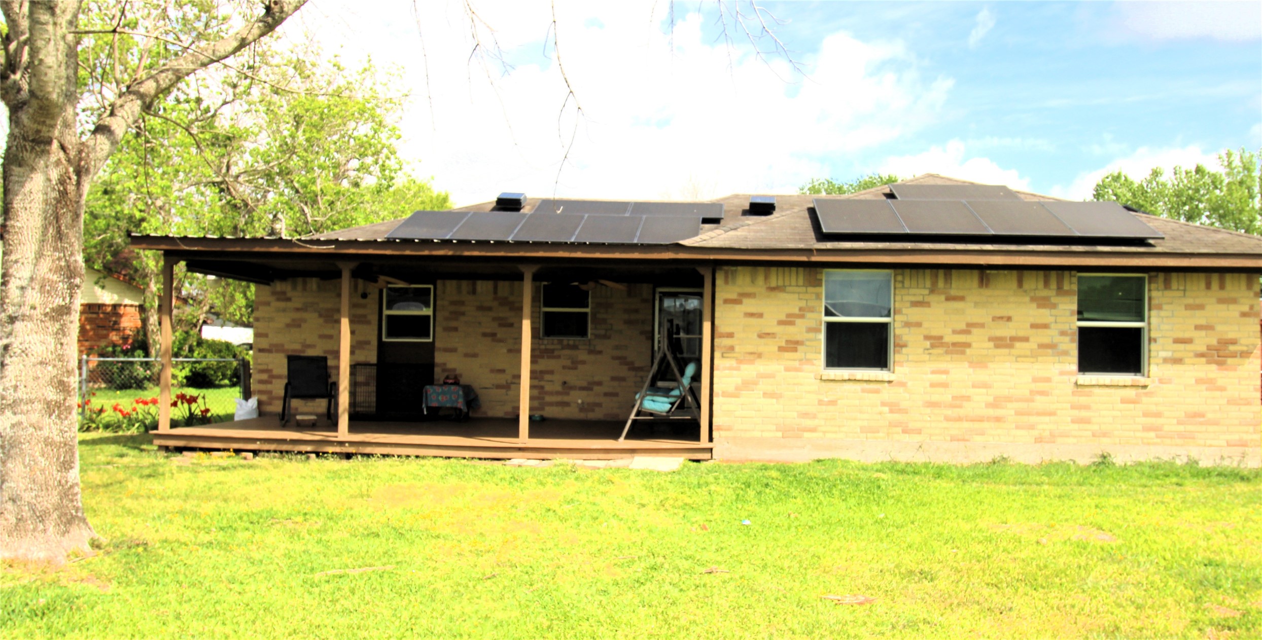 303 North 9th Street Beasley, TX 77417 - Photo 20 of 41 This photo shows the back of the house with solar panels on the roof. The solar panels are included and will provide years of energy efficiency!