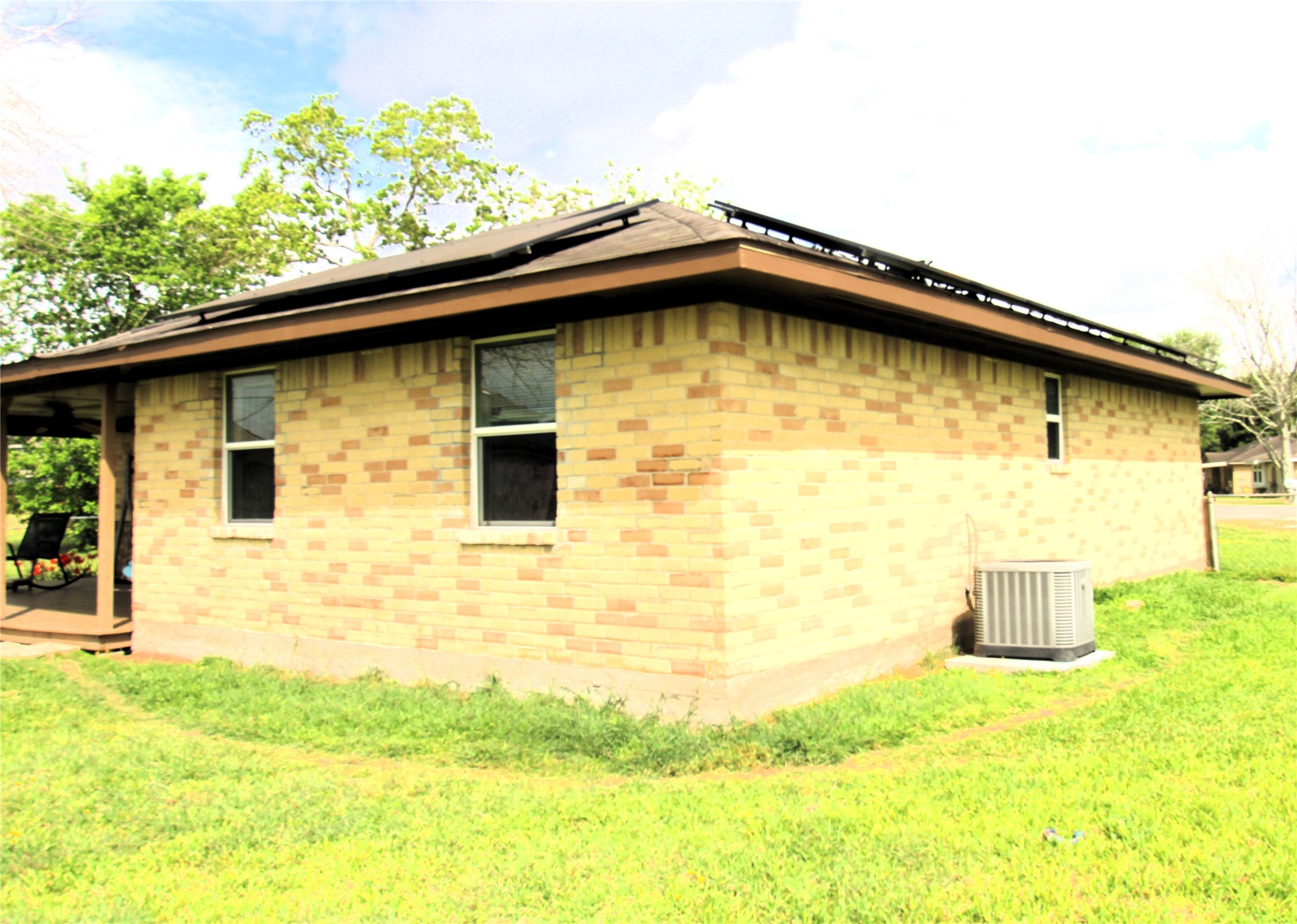 303 North 9th Street Beasley, TX 77417 - Photo 22 of 41 This image shows a single-story, brick home with ample double paned windows!