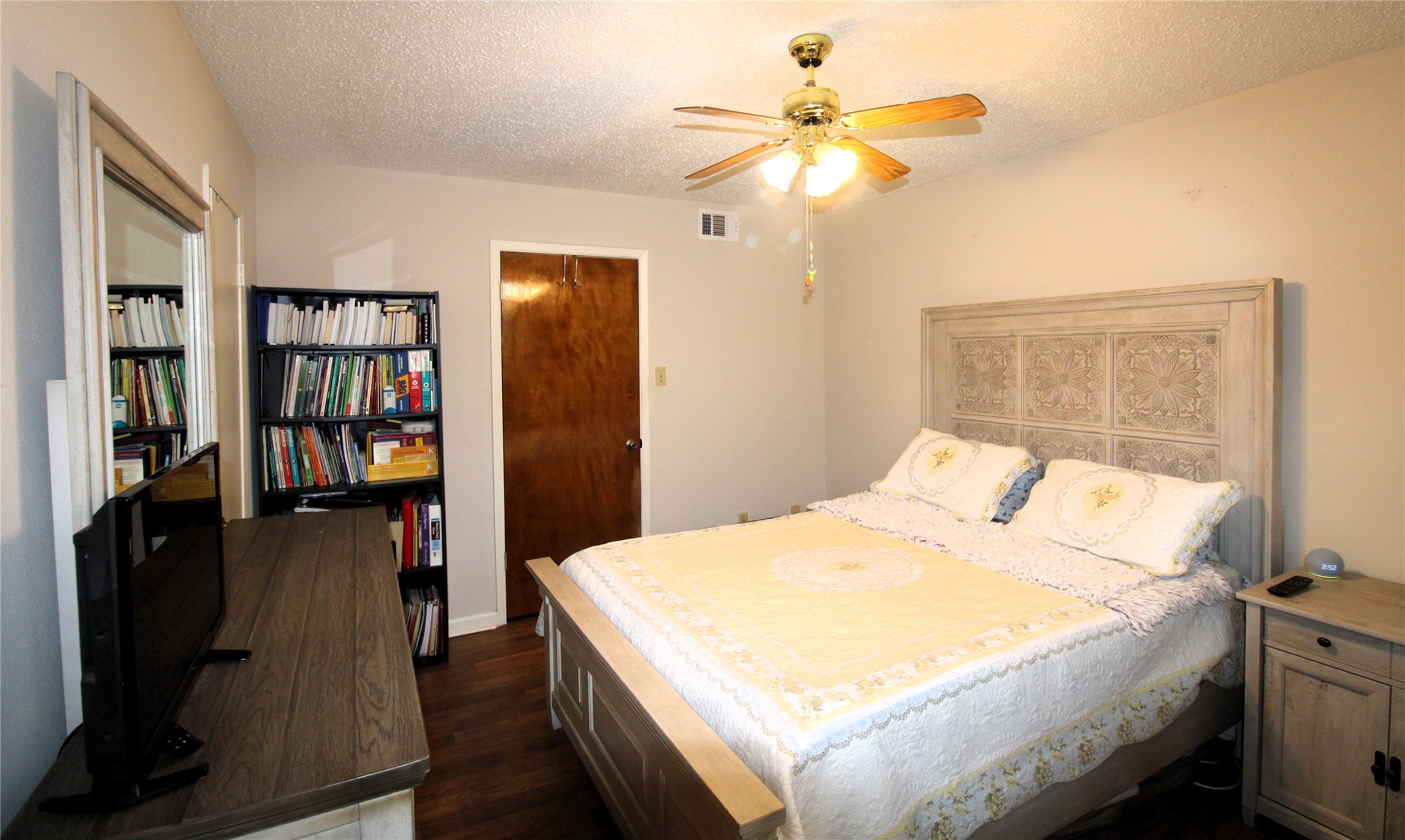 303 North 9th Street Beasley, TX 77417 - Photo 31 of 41 This bedroom view looks towards the hallway though the wooden door!
