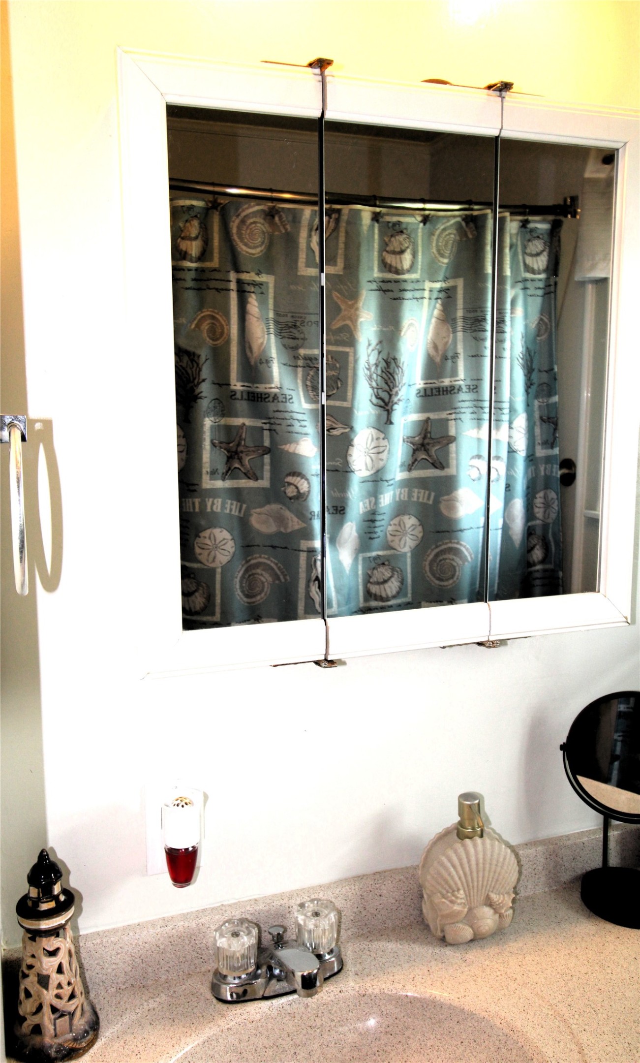 303 North 9th Street Beasley, TX 77417 - Photo 40 of 41 This photo shows a bathroom with a vanity mirror and sink featuring shower curtain with spacious tub/shower combination!