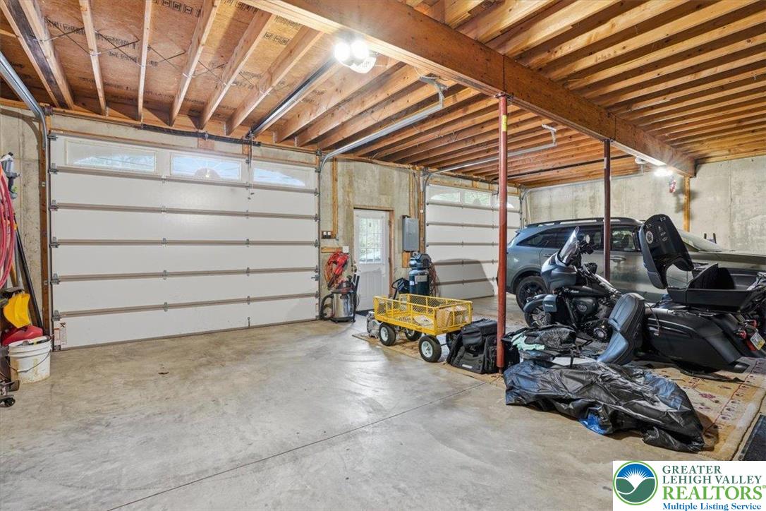 4880 Little Gap Road Kunkletown, PA 18058 - Photo 49 of 100 This spacious garage offers ample room for vehicles and storage, featuring durable concrete flooring.