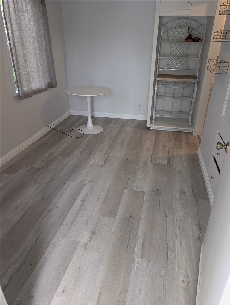 45 West Washington Boulevard Pasadena, CA 91103 - Photo 5 of 7 a view of an empty room with wooden floor and a window