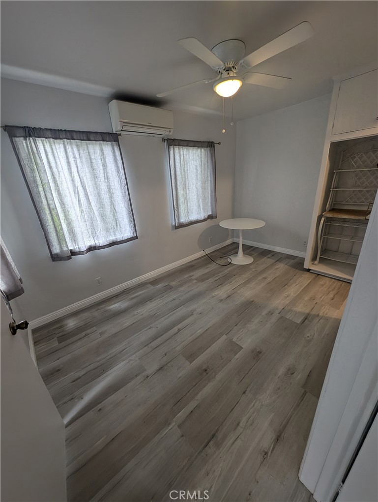 45 West Washington Boulevard Pasadena, CA 91103 - Photo 6 of 7 wooden floor in an empty room with a window