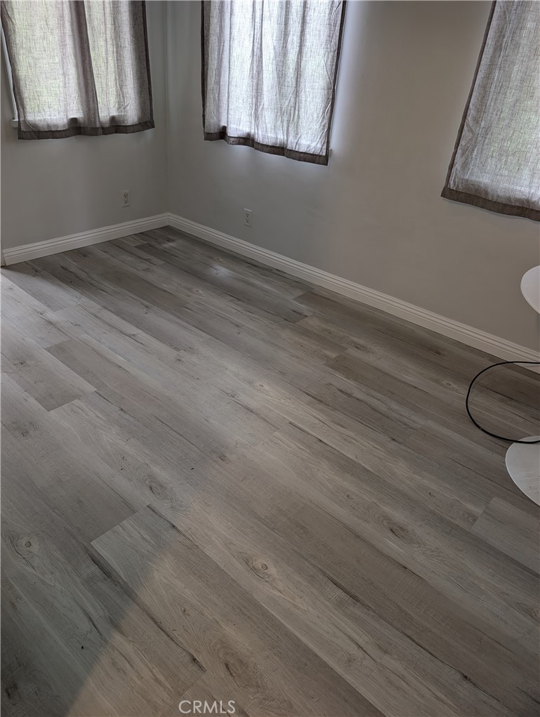 45 West Washington Boulevard Pasadena, CA 91103 - Photo 7 of 7 a room with wooden floor and window