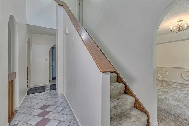 a view of a hallway with staircase