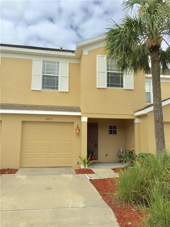 14953 Skip Jack Loop Lakewood Ranch, FL 34202 - Photo 1 of 1 a front view of a house with a yard and garage