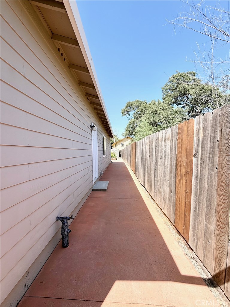 1037 Mark Twain Road Angels Camp, CA 95222 - Photo 46 of 52 a view of a backyard with wooden fence