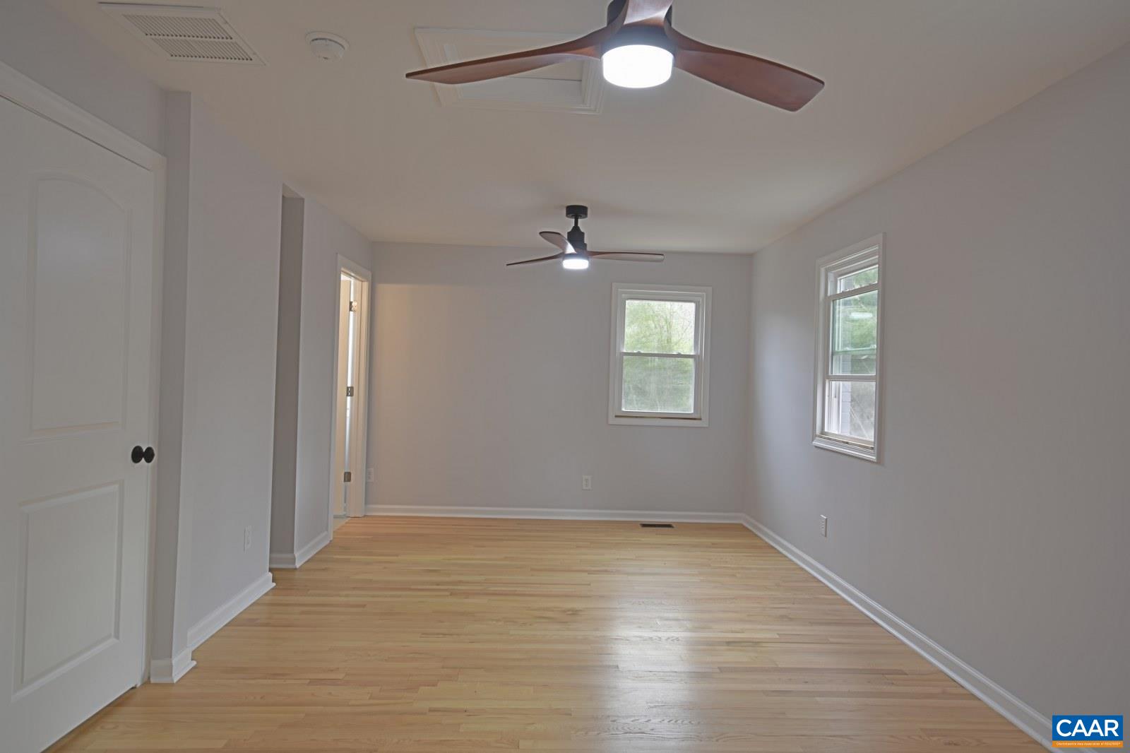 330 Brentwood Road Charlottesville, VA 22901 - Photo 13 of 26 wooden floor in an empty room with a window