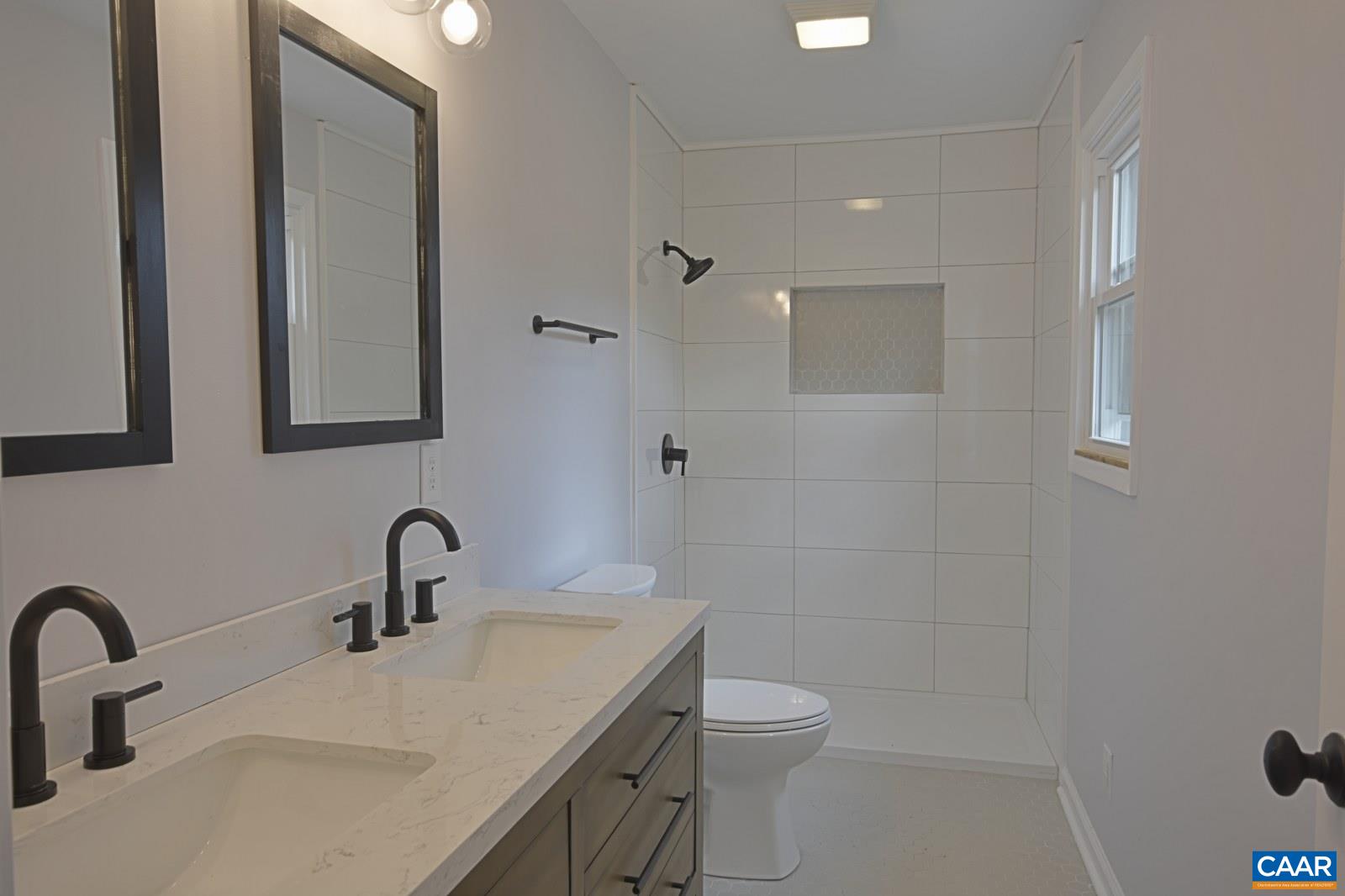 330 Brentwood Road Charlottesville, VA 22901 - Photo 14 of 26 a bathroom with a sink a toilet and mirror
