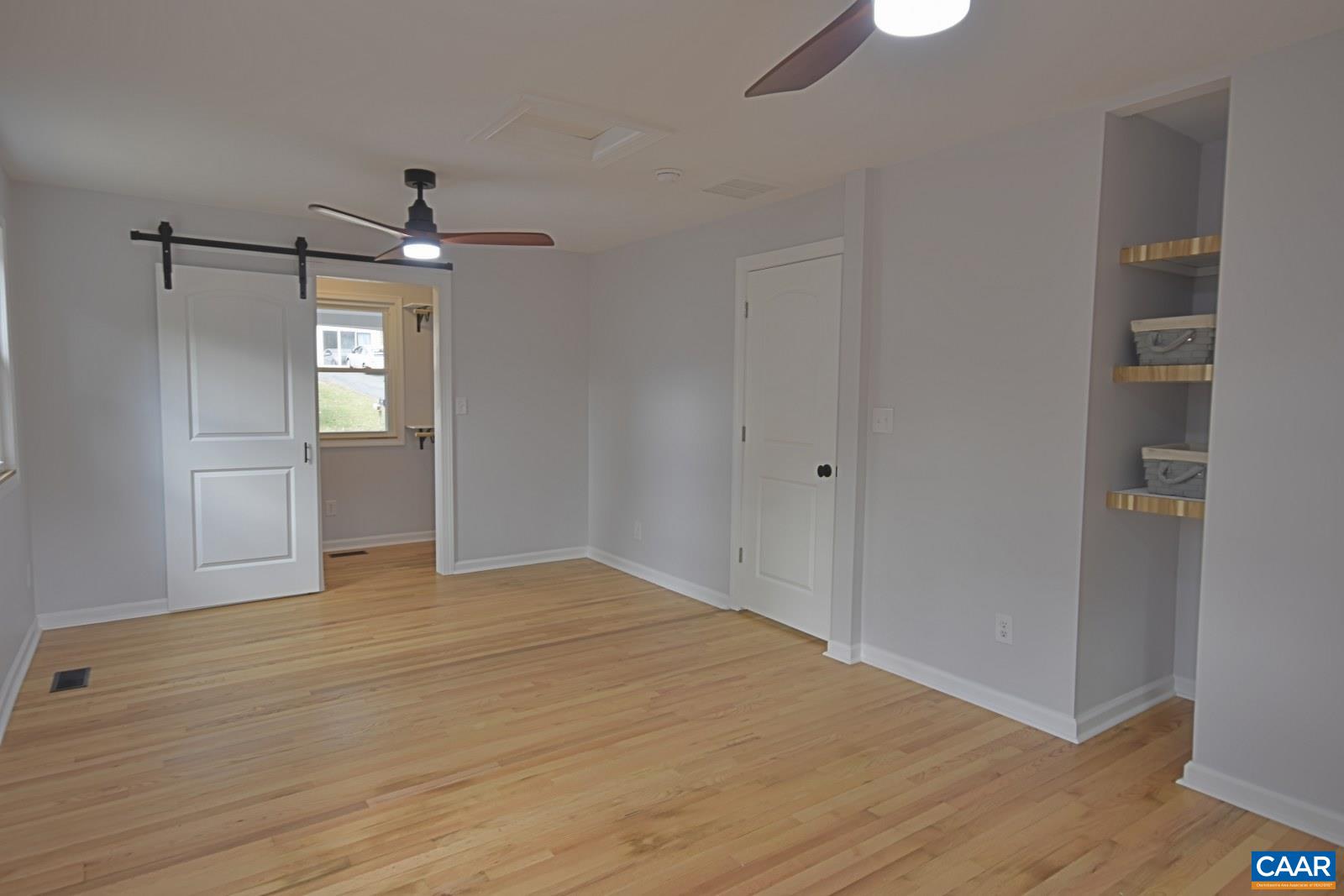 330 Brentwood Road Charlottesville, VA 22901 - Photo 15 of 26 a view of empty room with wooden floor and windows