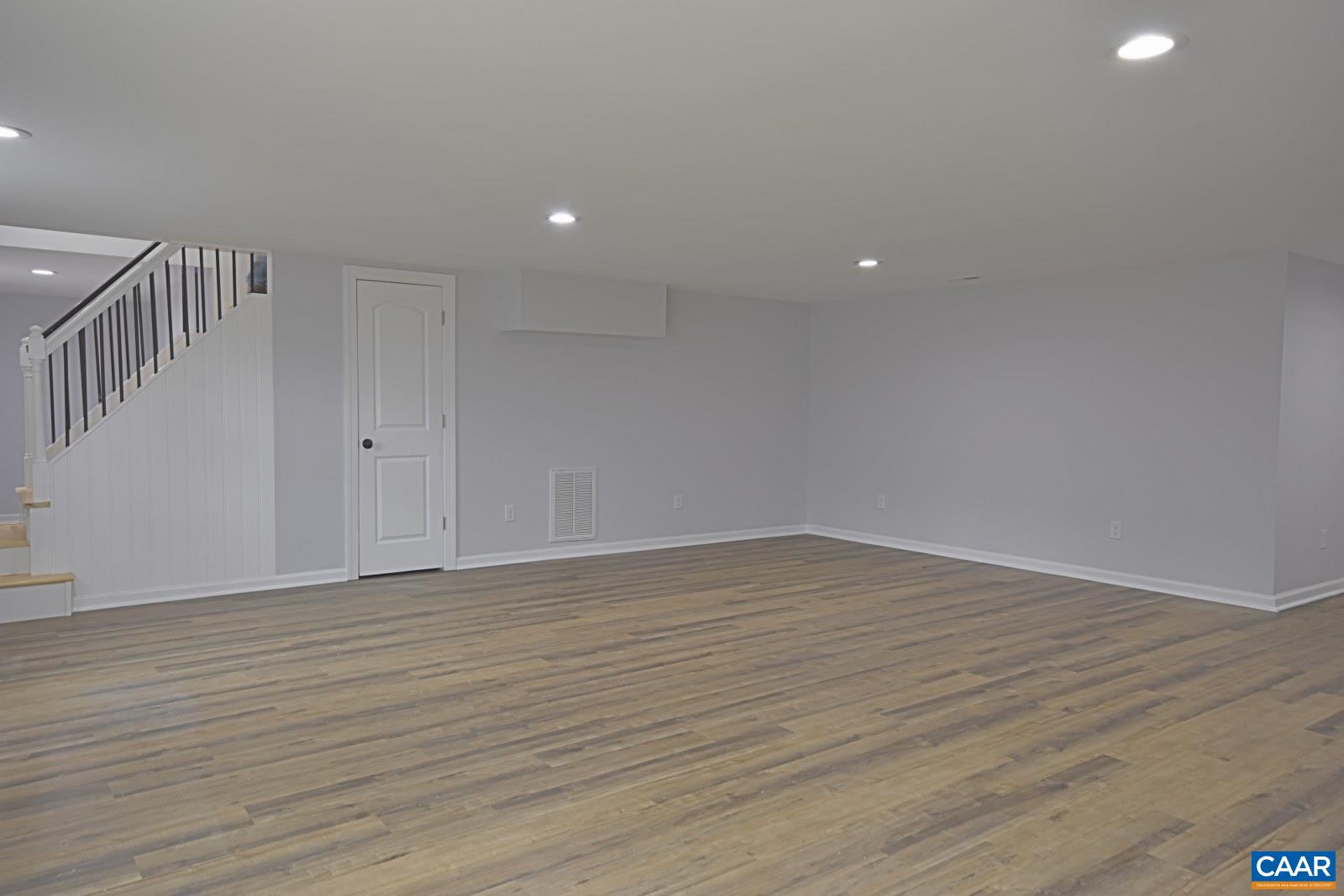 330 Brentwood Road Charlottesville, VA 22901 - Photo 19 of 26 a view of an empty room with wooden floor
