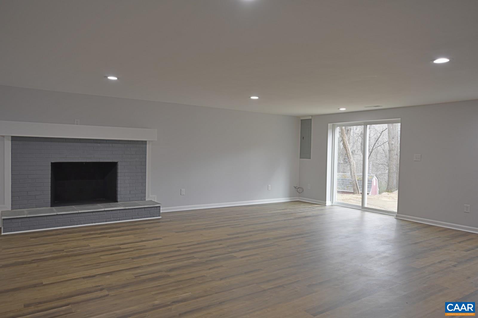 330 Brentwood Road Charlottesville, VA 22901 - Photo 21 of 26 a view of an empty room with wooden floor and a window