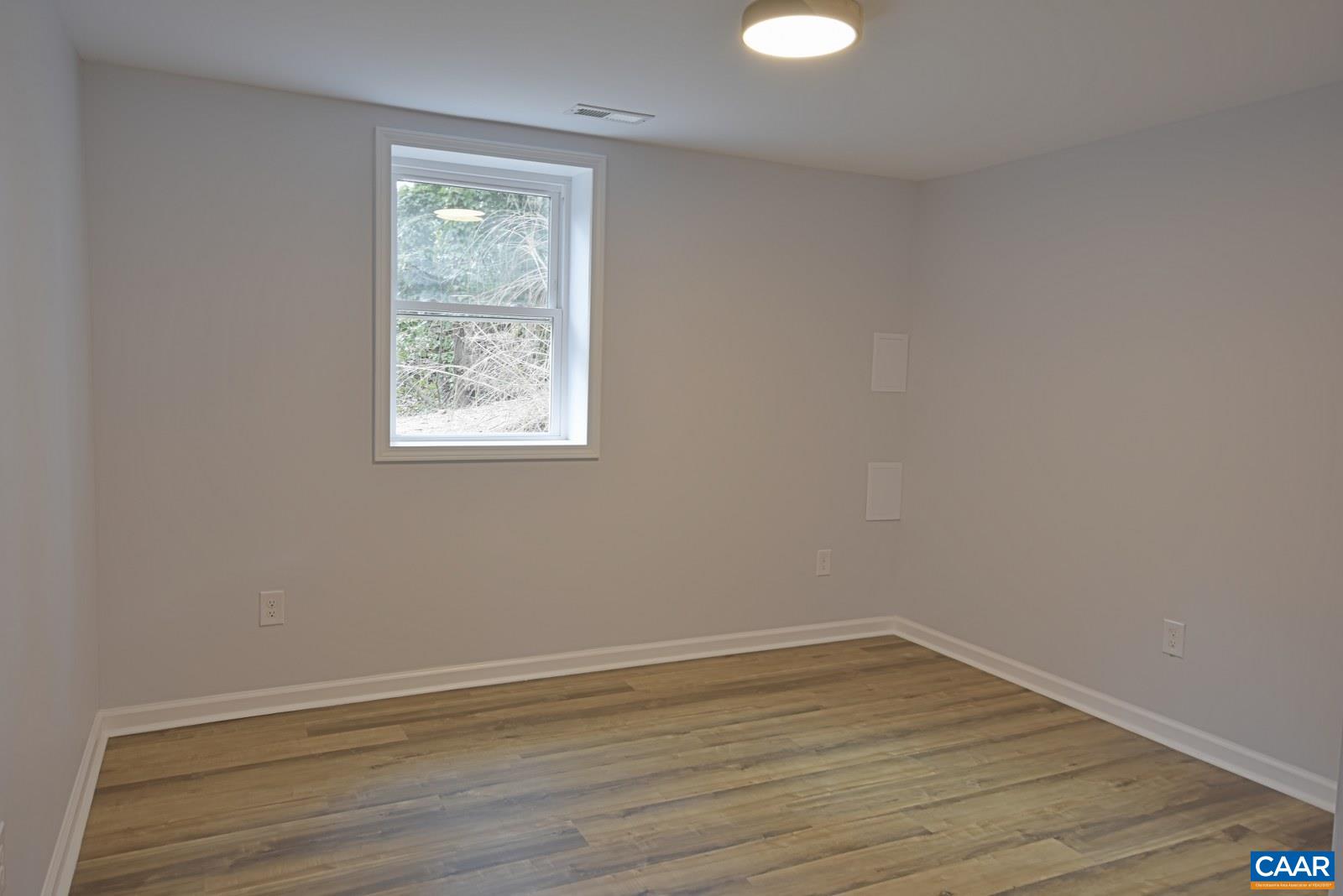 330 Brentwood Road Charlottesville, VA 22901 - Photo 23 of 26 wooden floor in an empty room with a window