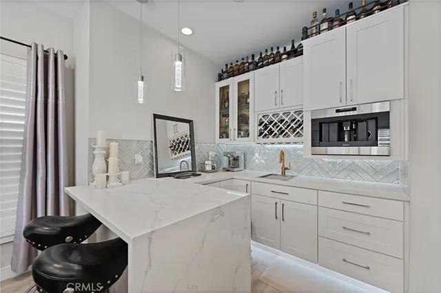 a kitchen with cabinets and white appliances