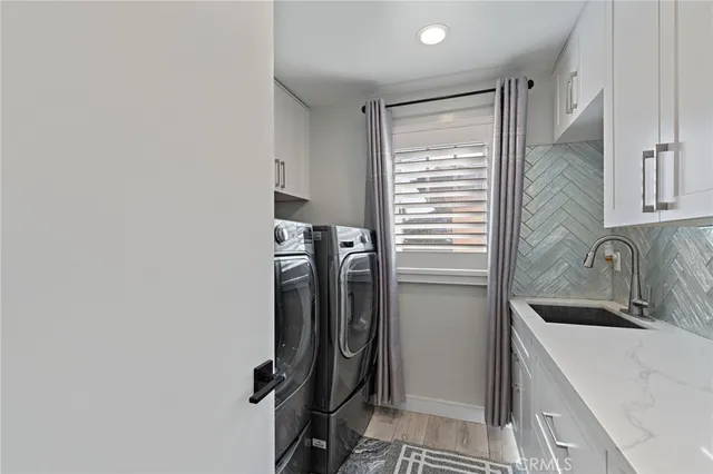 a kitchen with a refrigerator and a sink