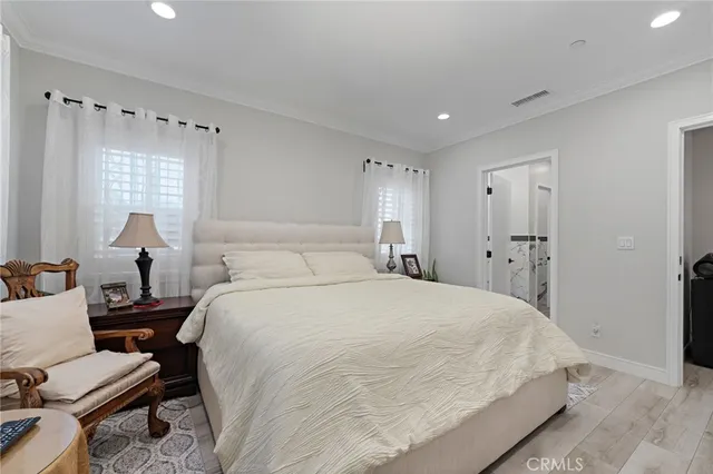 a bedroom with bed and window