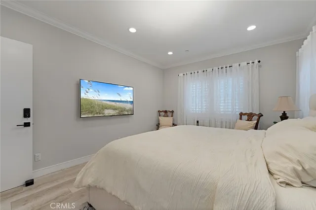 a bedroom with a bed and a painting