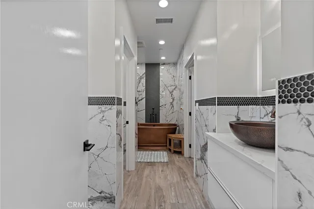 a spacious bathroom with a tub and shower