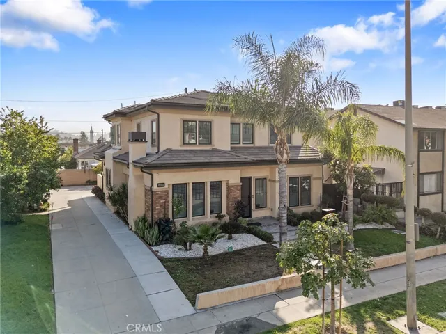 a front view of a house with garden