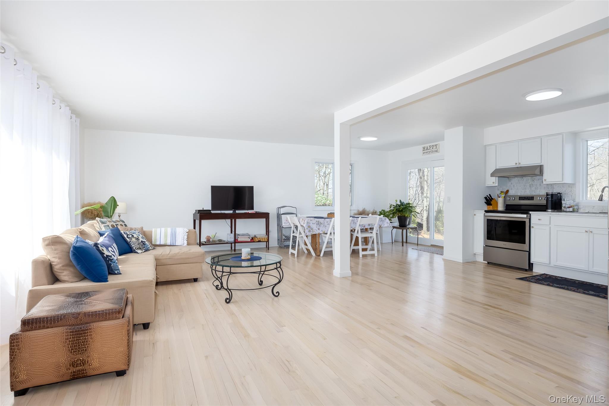 371 South River Road Calverton, NY 11933 - Photo 6 of 43 Living room with light wood-style floors and healthy amount of natural light