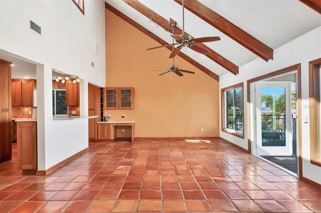 a view of a hallway with an entryway and livingroom
