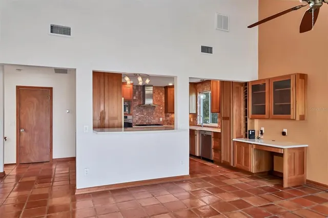 a kitchen with stainless steel appliances a refrigerator sink and microwave
