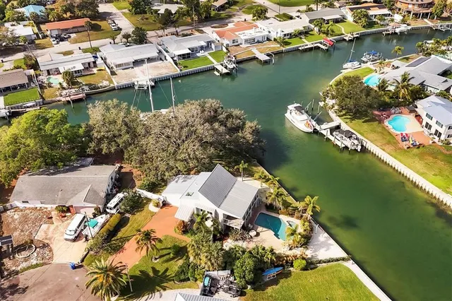 an aerial view of a house with a lake view