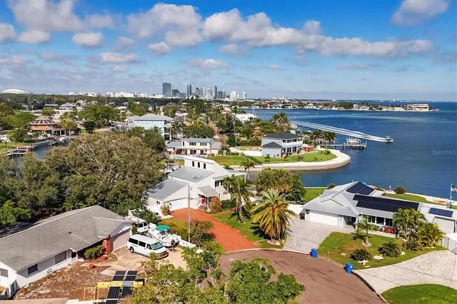 an aerial view of a house with a ocean view