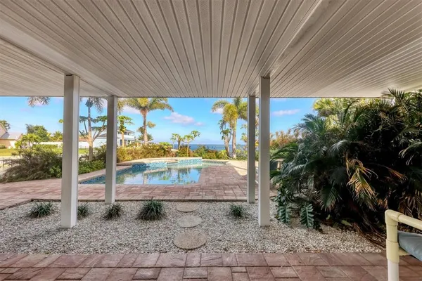 a view of a patio with a table chairs and a patio