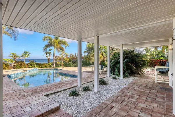 a view of a swimming pool with a patio