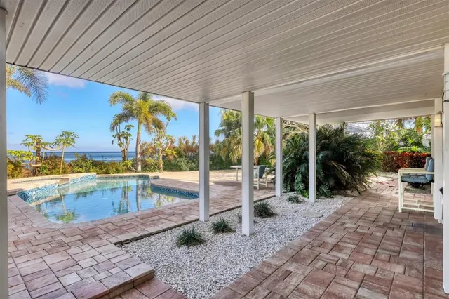 a view of a swimming pool with a patio