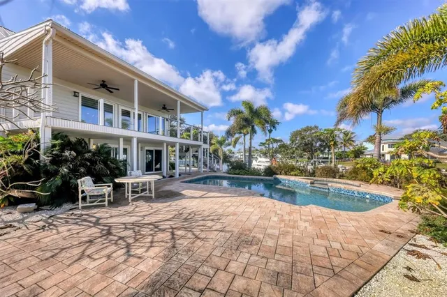 a view of a yard with swimming pool
