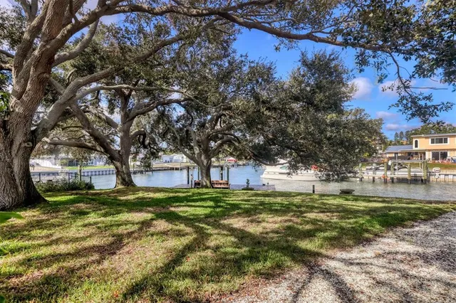 an aerial view of a house with a ocean view